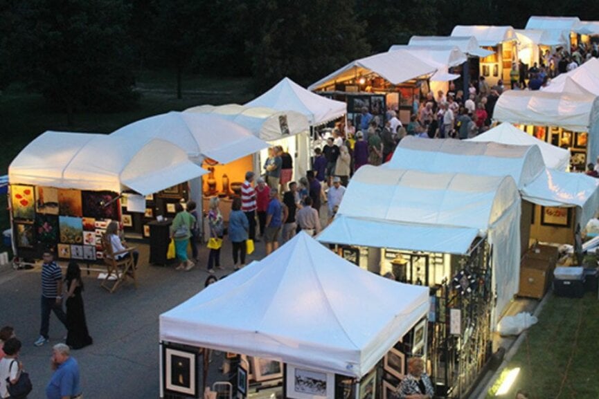 Tents with people attending an outdoor art show